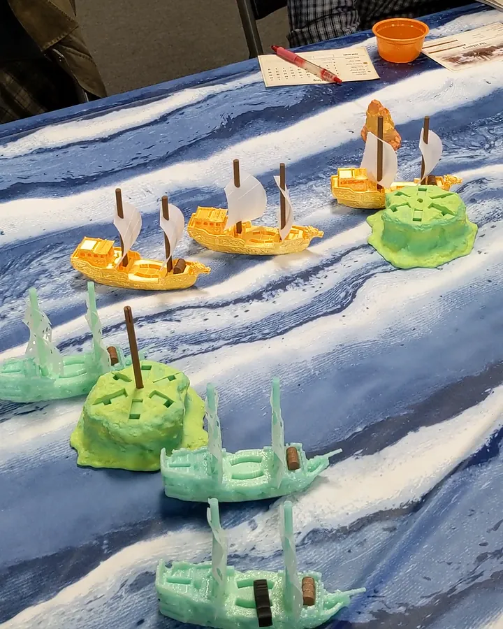 Three gold Treasure Fleet junks and teal Shadow Fleet galleons sailing between islands.