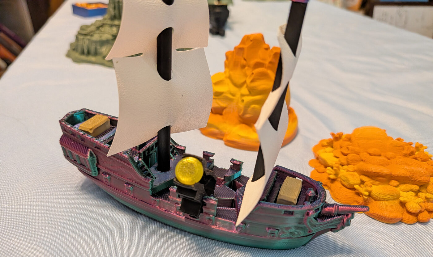 Queen's Fleet — three-ship fleet, sails, and faction card.